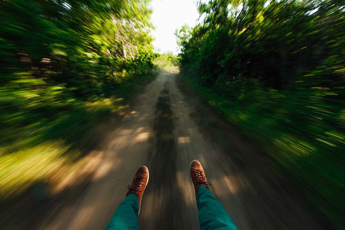 gravel time lapse photography of person road